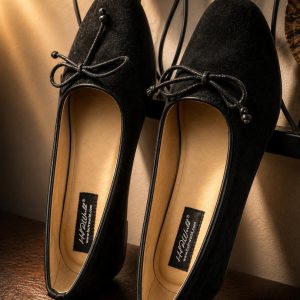 Black female pointed ballet flat shoe